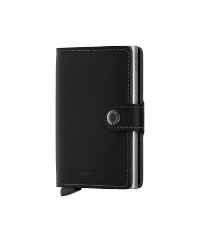 Secrid miniwallet Original Black is gemaakt van gecorrigeerd leer. De wallet draagt 4 verdikte of 6 platte kaarten, 4 extra kaarten, bankbiljetten, visitekaartjes en bonnetjes