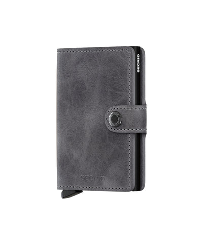 Secrid miniwallet Vintage Grey-Black is gemaakt van gecorrigeerd leer. De wallet draagt 4 verdikte of 6 platte kaarten, 4 extra kaarten, bankbiljetten, visitekaartjes en bonnetjes